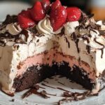 Easy Brownie Ice Cream Cake topped with chocolate drizzle and sprinkles