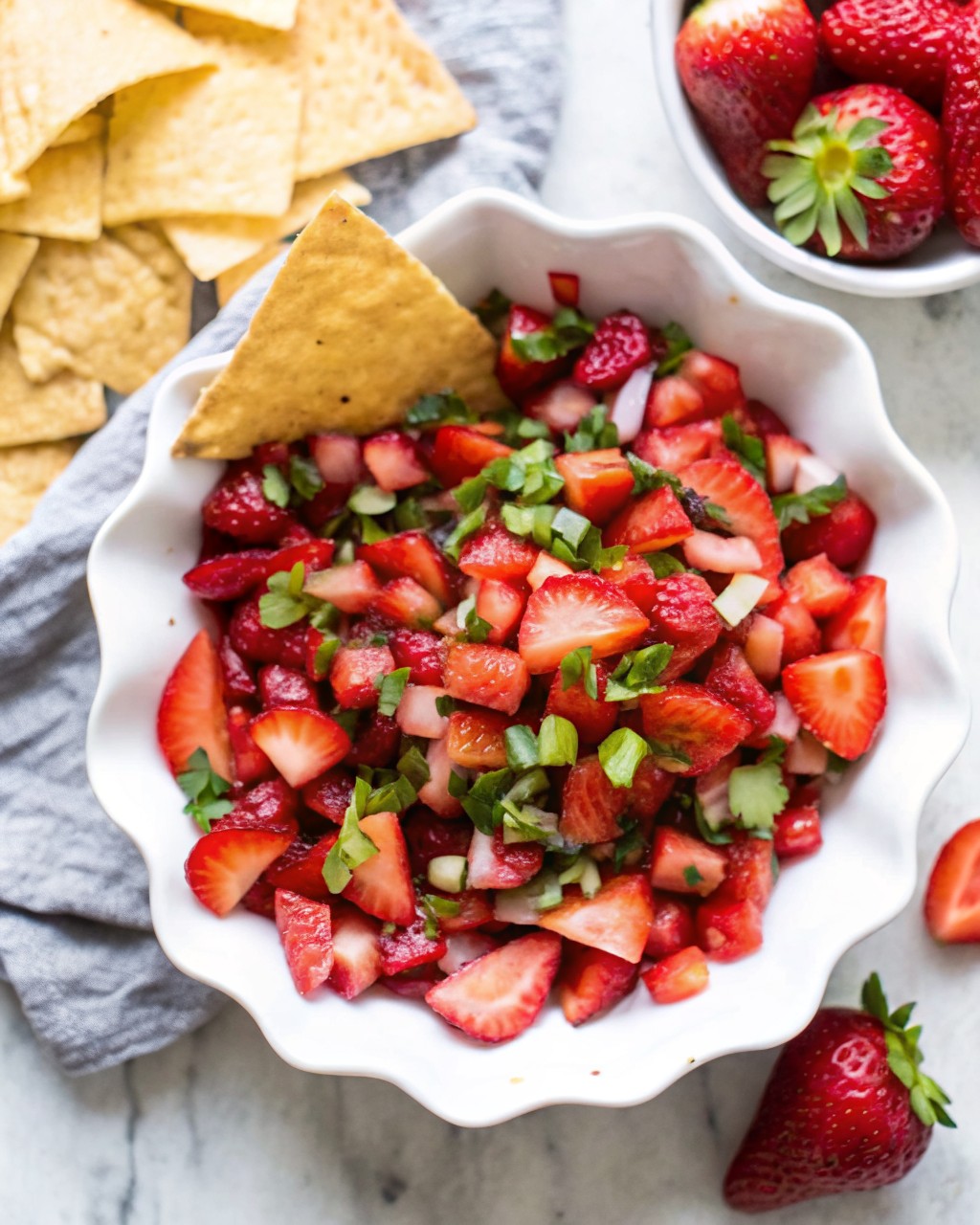 Bowl of fresh fruit salsa with golden cinnamon sugar tortilla chips