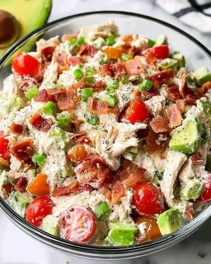 Bowl of creamy classic chicken salad with celery and grapes