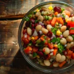 Dense bean salad in a rustic bowl