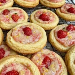 Soft and chewy strawberry lemonade cookies topped with powdered sugar