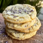 Close-up of Lemon Lavender Cookies with a golden edge, on a floral plate with lemon slices
